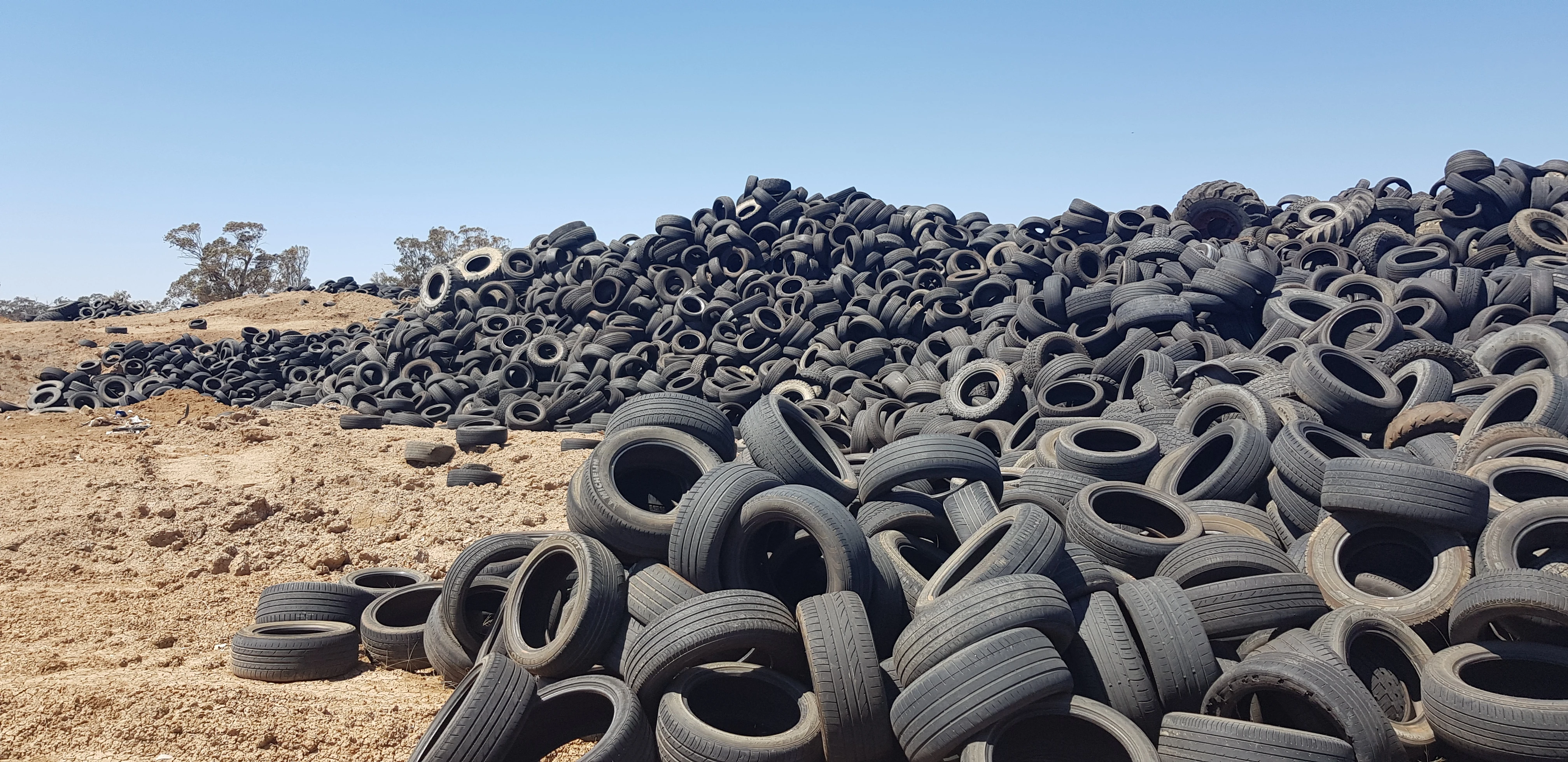 Stockpiled end-of-life tyres, illustrating a material stream for recovery